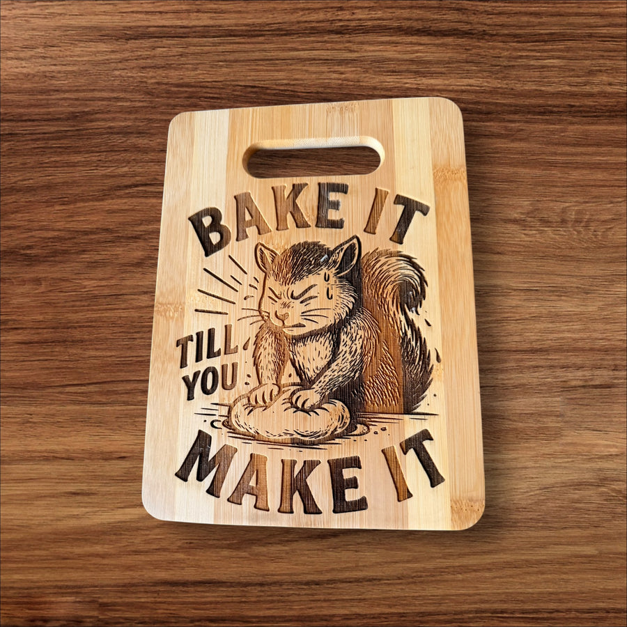“Bake It Till You Make It” Engraved Bamboo Cutting Board – 9x6”